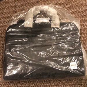 BRAND NEW fossil brief case